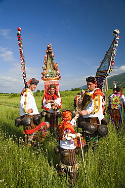 People in traditional costumes in a meadow, Rose Festival, Karlovo, Bulgaria, Europe