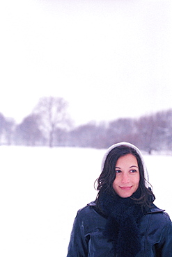 Smiling woman wearing in snow