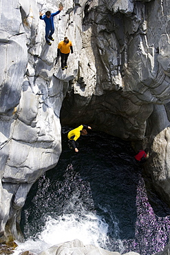 Young woman canyoning, Valle Maggia, Canton of Ticino, Switzerland, MR