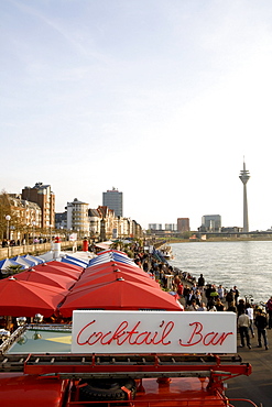 Riverside promenade and gastronomy along the Rhine with television tower in the background, old part of town, Düsseldorf, state capital of NRW, North-Rhine-Westphalia, Germany