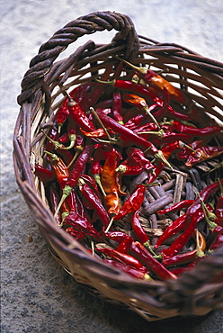 Dried chili peppers in a basket, Finca Monaber Vell, Majorca, Spain, Europe