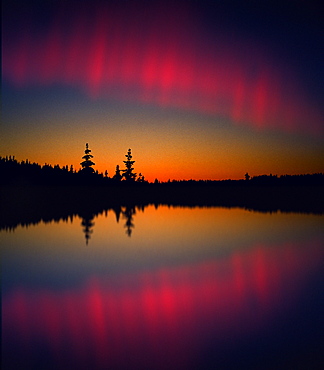 Northern lights reflecting on a lake, Lappland, Norway, Scandinavia, Europe