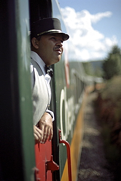 A conductor looking out of the window, Ferrocarril Chihuahua al Pacifico, Chihuahua express, Mexico, America