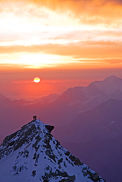 Two climbers on top of second summit of Bishorn at sunrise, Bishorn, 4135 meters, Valais, Wallis, Switzerland, Alps