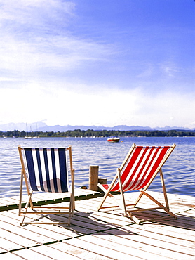 Stripy deckchairs on jetty, Starnberger See, Upper Bavaria, Deutschland