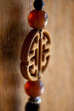 Detail shot of a Chinese, decorative key chain. Bali, Indonesia.