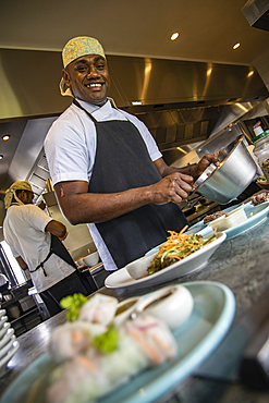 Friendly chef prepares lunch at the Tovolea Restaurant at Six Senses Fiji Resort, Malolo Island, Mamanuca Group, Fiji Islands, South Pacific