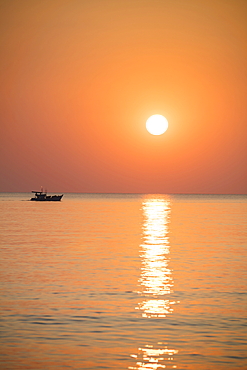 Silhouette of fishing boat at sunset, Ong Lang, Phu Quoc Island, Kien Giang, Vietnam, Asia