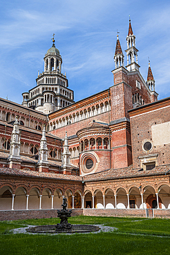 small cloister with a garden in the middle, Certosa di Pavia monastery (“Gratiarum Chartusiae”), Pavia province, Lombardy, Italy, Europe