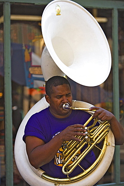 Man playing a sousaphone, a type of tuba, French Quarter, New Orleans, Louisiana, USA