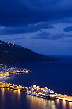 Cruise ship, Crucero Aida, in the harbour Santa Cruz de la Palma at dusk, UNESCO Biosphere Reserve, La Palma, Canary Islands, Spain, Europe