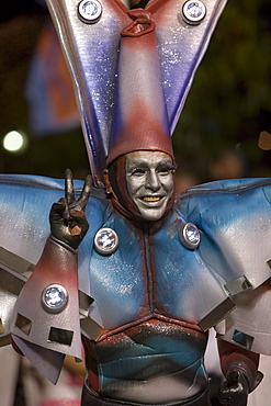 Man in colourful space costume at the Carnival Parade, Funchal, Madeira, Portugal