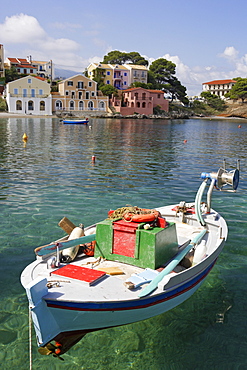 A boat is moored in the pure waters of Assos harbour, Cephalonia, Ionian Islands, Greece