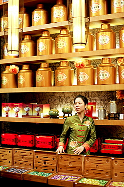 Young saleswoman at a tea shop, Xiamen, Fujian province, China, Asia