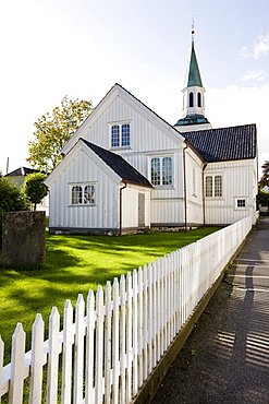 Wooden fence and church at Risor, Skagerrak, Sorland, Norway, Scandinavia, Europe