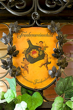 Sign amidst vine leaves, Hotel and Restaurant Loewen, Marktbreit, Franconia, Bavaria, Germany