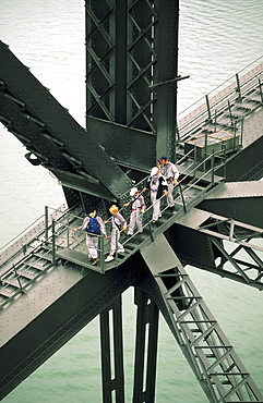 People climbing on the steel beam of the Harbour Bridge, Sydney, New South Wales, Australia