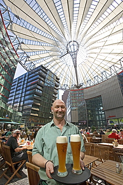 CafâˆšÃ‰Â¬Â© Sony Center, waiter with glasses of beer, Berlin, Germany