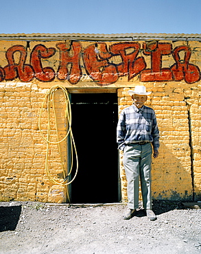 An old man standing at the entrance of a workshop, Texocuixpan, Tlaxcala province, Mexico, America