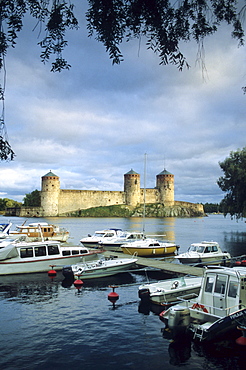 The Olavinlinna castle at Savonlinna lake at dusk, Karelia, Finland, Europe