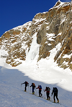 Cross-country skiers in a winter landscape under blue sky, Pflerscher valley, South Tyrol, Italy, Europe