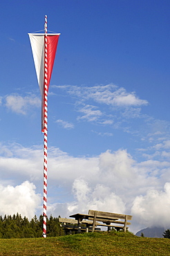 South Tyrolean flag with table and benches, South Tyrol, Italy