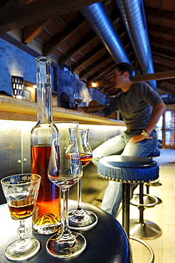 A man sitting in the bar of Hotel Bad Schoergau, Bad Schoergau, Valley Sarntal, South Tyrol, Italy, Europe