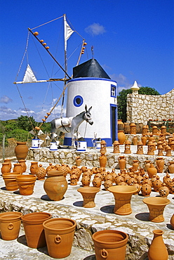 Windmill and pottery under blue sky, Algarve, Portugal, Europe