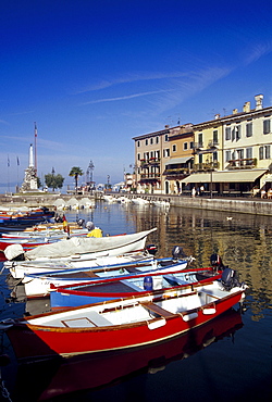 Fishing boats at harbour in the sunlight, Lazise, Lake Garda, Veneto, Italy, Europe