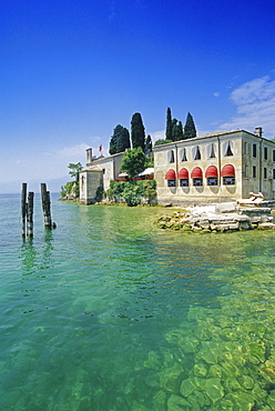 View at the restaurant Locando San Vigilio at the lakeside, Punta San Vigilio, Lake Garda, Veneto, Italy, Europe