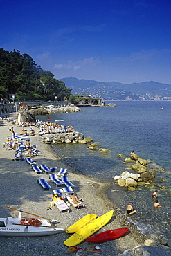 People on the beach under blue sky, Liguria, Italian Riviera, Italy, Europe