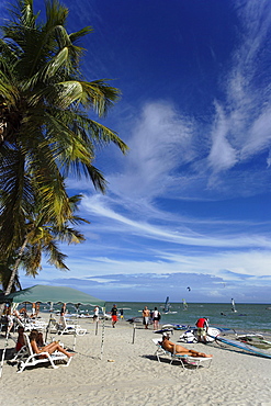 Tourists sunbathing at beach of Playa El Yaque, Isla Margarita, Nueva Esparta, Venezuela