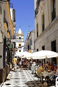 Pavement cafes in a lane, church Iglesia del Socorro in background, Plaza del Socorro, Ronda, Andalusia, Spain