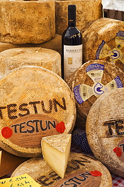 Cheese stall at the market in Alba, Piedmont, Italy