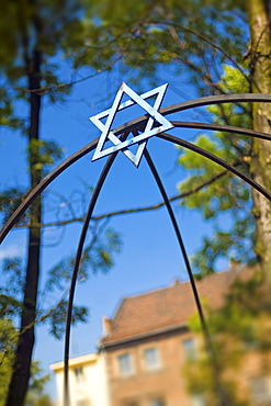 Jewish Star in courtyard on Szeroka in Jewish Kazimierz Quarter, Krakow, Poland, Europe