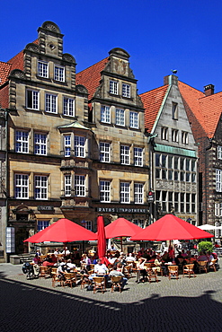 Historical houses and sidewalk cafes at the market square under blue sky, Hanseatic City of Bremen, Germany, Europe