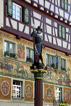 Facades and figure on a fountain at the city hall square, Stein am Rhein, High Rhine, Lake Constance, Canton Schaffhausen, Switzerland, Europe