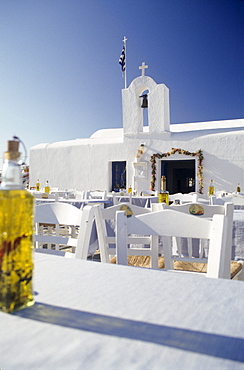 Tables and chairs on the terrace, Restaurant in Naussa, Paros, Mediterranean sea, Greece, Europe