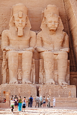 Tourists in front of the giant statues at the Temple of Rameses II., Abu Simbel, Egypt, Africa