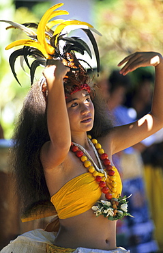 Young woman dancing a dance of welcome in the town of Hakahau on the Island of Ua Pou, French Polynesia