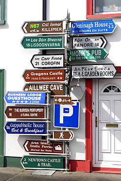 Signposts in the centre of the Ballyvaughan, Ballyvaughan, Galway Bay, County Clare, Ireland