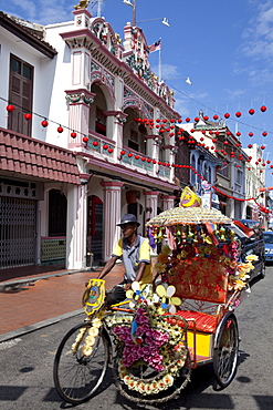 Decorated Rickshaw in the historical center of Malacca, Malaysia, Asia.