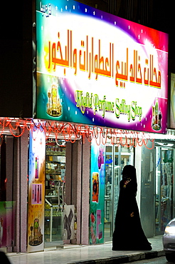 An Arabian woman with veil shopping, Perfumery, Rash al Khaimah, United Arab Emirates