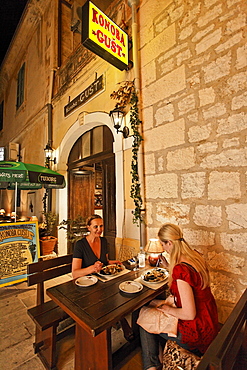 Women having dinner in restaurant Konoba Gust, Bol, Brac, Split-Dalmatia, Croatia