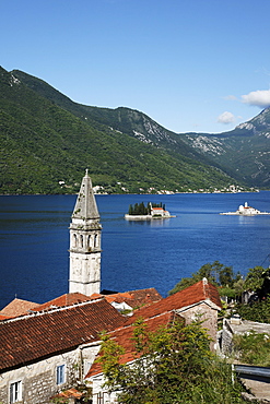 View of Sveti Nikola church with bell tower, in the background Gospa od Skrpjela island and Sveti Dorde island, Perast, Bay of Kotor, Montenegro, Europe