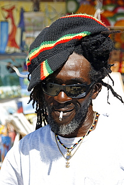 Jamaica Negril beach cool Rastafari man in front of fashion shop