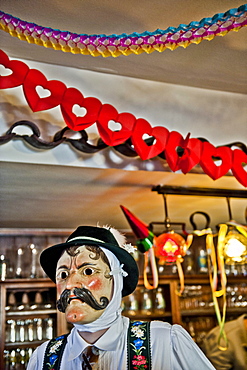 Disguised person at a pub, Mittenwald, Bavaria, Germany, Europe