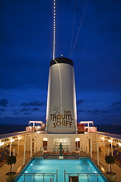 Pool and funnel of cruiseship MS Deutschland (Reederei Peter Deilmann) at dusk, near Malmo, Skane, Sweden