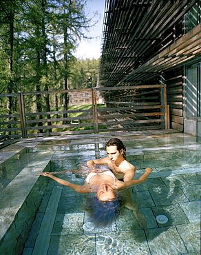 Watsu treatment in an outdoor pool, Vigilius Mountain Resort, Vigiljoch, Lana, Trentino-Alto Adige/Suedtirol, Italy