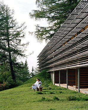 Hotel guests sitting on a bench near hotel, Vigilius Mountain Resort, Vigiljoch, Lana, Trentino-Alto Adige/Suedtirol, Italy